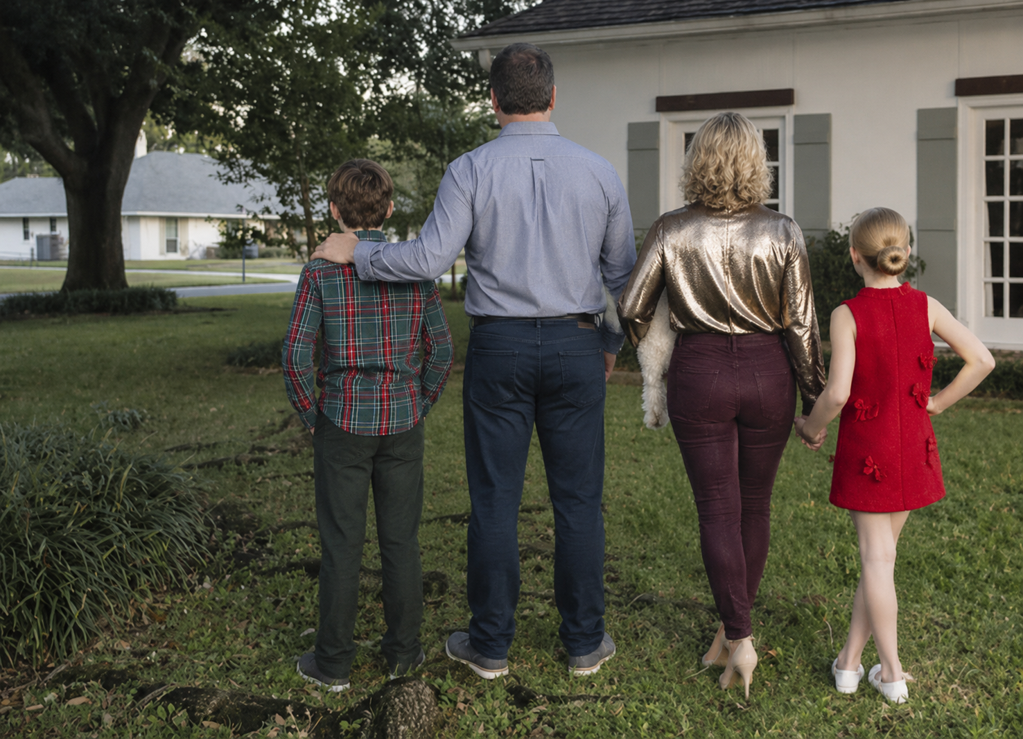 Ashley with her family outside their Baton Rouge home
